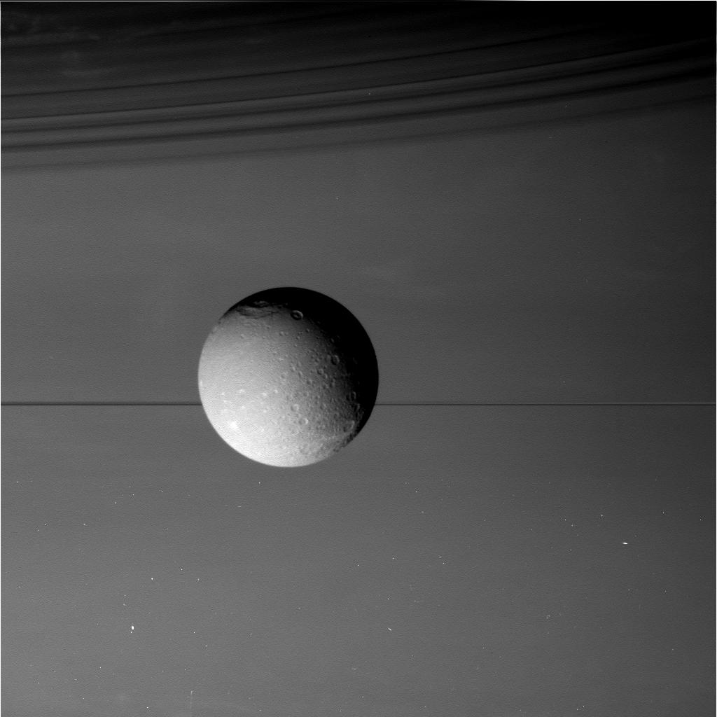 August 17, 2015, view of Saturn's moon Dione in front of the giant planet