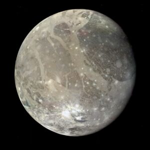 A mosaic of spacecraft images shows the varied surface of Ganymede