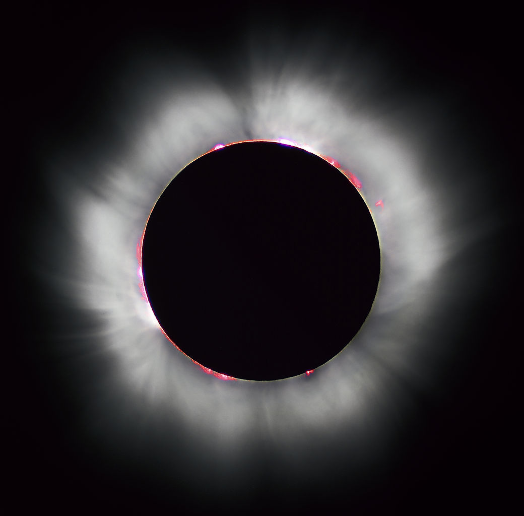 The Sun's corona shines around the intervening Moon during a total solar eclipse