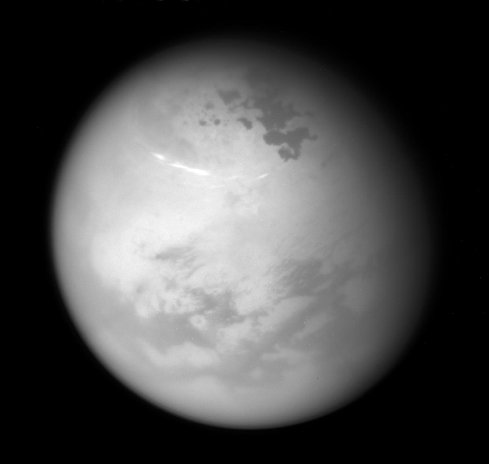 Cassini view of Titan lakes, clouds