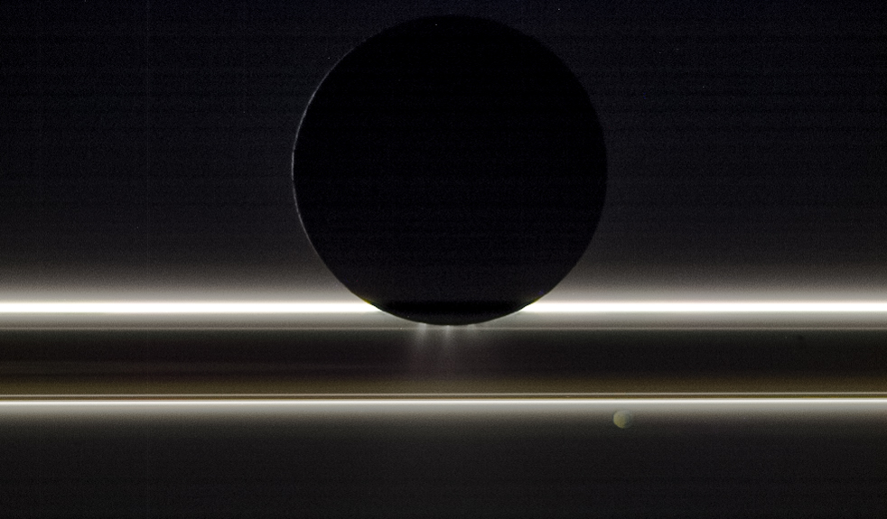 Enceladus passes in front of Saturn's rings